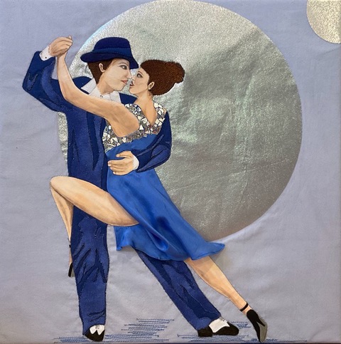 An image of a man and woman dancing the tango. Both of them have brown hair, pale skin, and are wearing blue. The are placed in front of a silver moon.