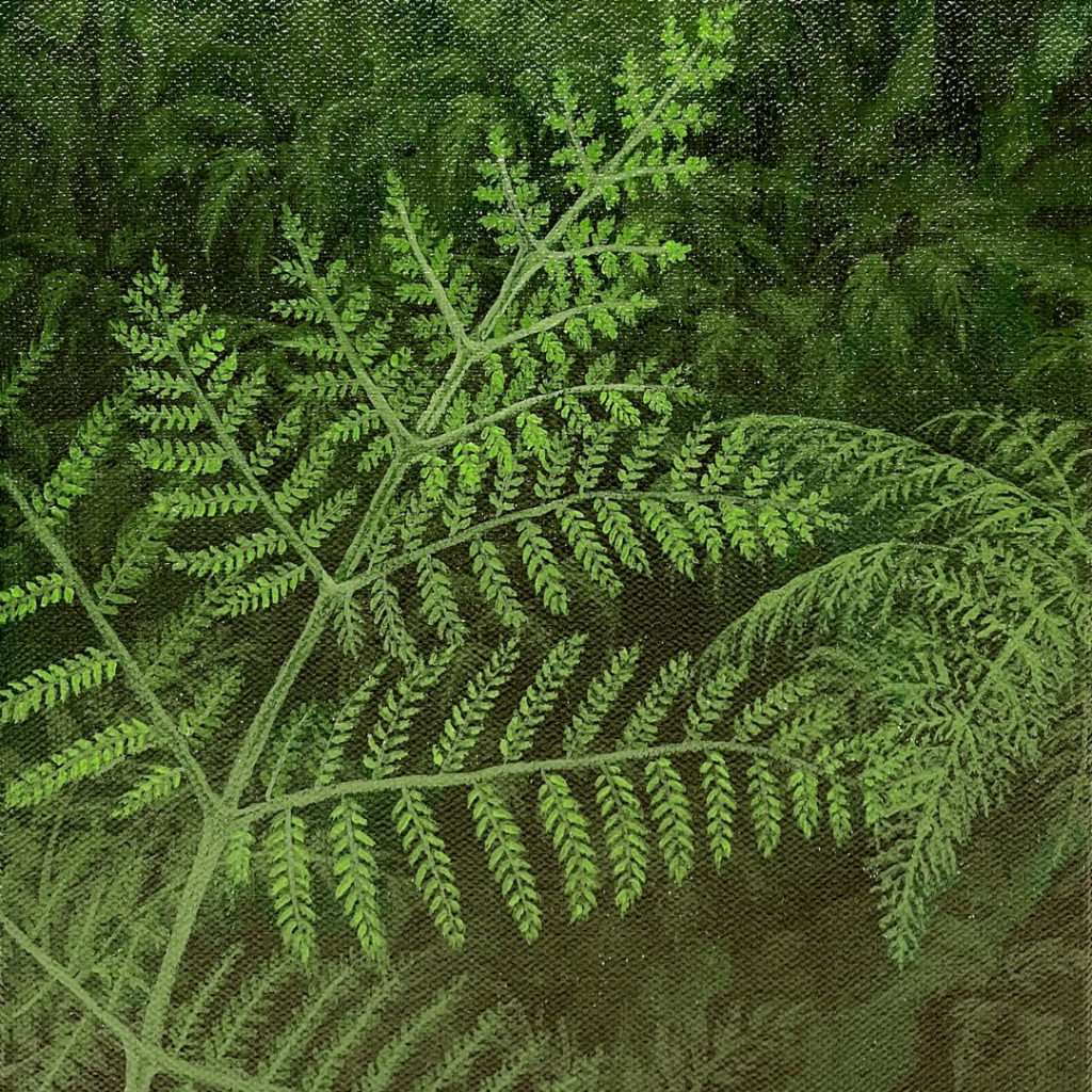 A light green print of leaves pressed onto a darker green background