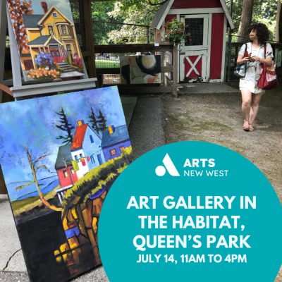 Brightly coloured paintings sit on easels inside the Queen's Park Habitat outdoor space. A red and white barn stands in the background.